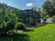 This backyard boasts lush greenery and mature trees, perfect for relaxation or outdoor activities at 1073 Vinsetta Cir, Winter Garden, FL 34787