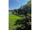 An expansive backyard featuring verdant lawn and lush shrubbery for added privacy at 1073 Vinsetta Cir, Winter Garden, FL 34787