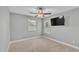 Bedroom featuring neutral walls and carpet, a ceiling fan and two windows at 1073 Vinsetta Cir, Winter Garden, FL 34787