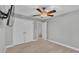 Bedroom featuring neutral walls and carpet, a ceiling fan, tv, and a large closet at 1073 Vinsetta Cir, Winter Garden, FL 34787