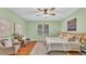 Relaxing bedroom featuring a ceiling fan and a picturesque window at 1073 Vinsetta Cir, Winter Garden, FL 34787