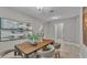 Dining room with a wood table, seating for six, neutral chairs, and stylish decor at 1073 Vinsetta Cir, Winter Garden, FL 34787