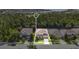 Stunning view of a home surrounded with lawn and a forest backdrop at 1073 Vinsetta Cir, Winter Garden, FL 34787