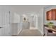 Second floor hallway featuring a built-in desk area, two doors and neutral carpet at 1073 Vinsetta Cir, Winter Garden, FL 34787