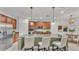 Well-equipped kitchen with a center island, granite countertops, and modern appliances at 1073 Vinsetta Cir, Winter Garden, FL 34787