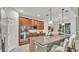 Spacious kitchen with granite countertops, stainless steel appliances, and ample cabinet space at 1073 Vinsetta Cir, Winter Garden, FL 34787
