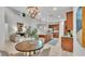 Open concept kitchen, dining, and living area with stainless steel appliances at 1073 Vinsetta Cir, Winter Garden, FL 34787
