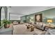 Relaxing living area with green walls and natural light at 1073 Vinsetta Cir, Winter Garden, FL 34787