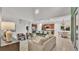 Bright and airy living area with an open floor plan connecting the kitchen and living room at 1073 Vinsetta Cir, Winter Garden, FL 34787