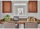 Office space with built-in desk and cabinets, granite countertop and two chairs at 1073 Vinsetta Cir, Winter Garden, FL 34787