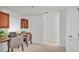 Office space with built-in desk, cabinets and two chairs at 1073 Vinsetta Cir, Winter Garden, FL 34787