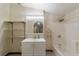 Bathroom featuring a shower-tub combo, vanity with mirror, and shelving for storage at 11 Se 31St St, Ocala, FL 34471