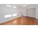 Bedroom featuring hardwood floors, ample closet space, and a ceiling fan at 11 Se 31St St, Ocala, FL 34471