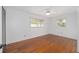Bright bedroom with hardwood floors, a ceiling fan, and natural light at 11 Se 31St St, Ocala, FL 34471