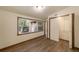 Bedroom with luxury vinyl flooring, a window, and a closet for ample storage at 11 Se 31St St, Ocala, FL 34471