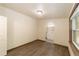 A cozy bedroom showcases arched access to a connected bathroom and luxury vinyl flooring at 11 Se 31St St, Ocala, FL 34471