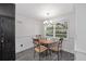 Bright dining area with backyard views, table with four chairs, and hanging light fixture at 11 Se 31St St, Ocala, FL 34471