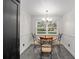 Cozy dining nook with backyard view, table with four chairs, and chandelier at 11 Se 31St St, Ocala, FL 34471
