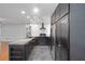 This spacious kitchen has stainless steel appliances, marble backsplash and stylish lighting at 11 Se 31St St, Ocala, FL 34471