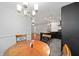 View of the modern kitchen with white marble backsplash and adjacent dining nook at 11 Se 31St St, Ocala, FL 34471