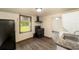 Kitchen equipped with dark appliances, a window, and a sleek design in a compact space at 11 Se 31St St, Ocala, FL 34471