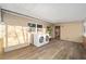 Bright laundry room features wood-look flooring and convenient, modern front-load washer and dryer set at 11 Se 31St St, Ocala, FL 34471