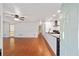 View from front door into living room open to modern kitchen with granite countertops at 11 Se 31St St, Ocala, FL 34471