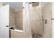 Walk-in shower with pebble floor and tiled walls in the bathroom at 11 Se 31St St, Ocala, FL 34471