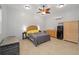 Studio with bed, kitchenette, ceiling fan, and neutral tiling at 11 Se 31St St, Ocala, FL 34471