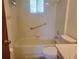 Bathroom with toilet, bathtub, and grab bar at 11255 Sw 76Th Ter, Ocala, FL 34476