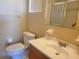 Bathroom with toilet, sink, and shower with glass doors at 11255 Sw 76Th Ter, Ocala, FL 34476