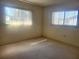 Bright bedroom with carpet and natural light from two windows at 11255 Sw 76Th Ter, Ocala, FL 34476
