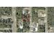 Aerial view of the property highlighting its location within a serene and wooded neighborhood at 114 Bay Dr, Ocklawaha, FL 32179
