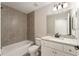 Neutral bathroom featuring a shower-tub combo and granite countertops at 114 Bay Dr, Ocklawaha, FL 32179