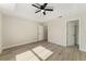 The spacious bedroom features neutral walls, closet and ceiling fan at 114 Bay Dr, Ocklawaha, FL 32179