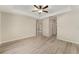 Spacious bedroom with ceiling fan, neutral walls, and plank floors at 114 Bay Dr, Ocklawaha, FL 32179