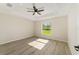 Bedroom with ceiling fan and a view of the outdoors at 114 Bay Dr, Ocklawaha, FL 32179