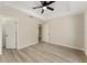 Spacious bedroom featuring neutral walls, a ceiling fan, and plank floors at 114 Bay Dr, Ocklawaha, FL 32179