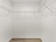 Walk-in closet with wire shelving and plank floors at 114 Bay Dr, Ocklawaha, FL 32179