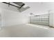 Spacious garage featuring a garage door with glass panels at 114 Bay Dr, Ocklawaha, FL 32179