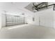 Spacious garage featuring a garage door with glass panels at 114 Bay Dr, Ocklawaha, FL 32179