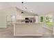 Spacious kitchen boasts granite countertops and stainless-steel appliances at 114 Bay Dr, Ocklawaha, FL 32179