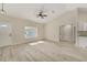 Living room with large window and luxury vinyl plank flooring at 114 Bay Dr, Ocklawaha, FL 32179