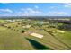 Panoramic aerial view showcasing a rural community with horse paddocks and tranquil ponds at 12424 Sw 140Th Loop, Dunnellon, FL 34432