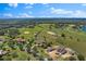 Wide aerial view of a sprawling estate with horse paddocks and tranquil ponds at 12424 Sw 140Th Loop, Dunnellon, FL 34432