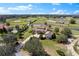 Expansive estate aerial view featuring beautiful pastures, ponds, horse riding area, and luxury home at 12424 Sw 140Th Loop, Dunnellon, FL 34432