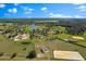 Expansive aerial shot showcasing a rural community with ponds and green pastures at 12424 Sw 140Th Loop, Dunnellon, FL 34432
