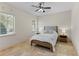 Bedroom features natural light from two windows and a ceiling fan for added comfort at 12424 Sw 140Th Loop, Dunnellon, FL 34432