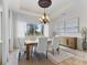Elegant dining room with chandelier and natural light at 12424 Sw 140Th Loop, Dunnellon, FL 34432