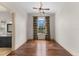 A versatile space with hardwood floors, a ceiling fan, and arched window, ready for personalization at 12424 Sw 140Th Loop, Dunnellon, FL 34432